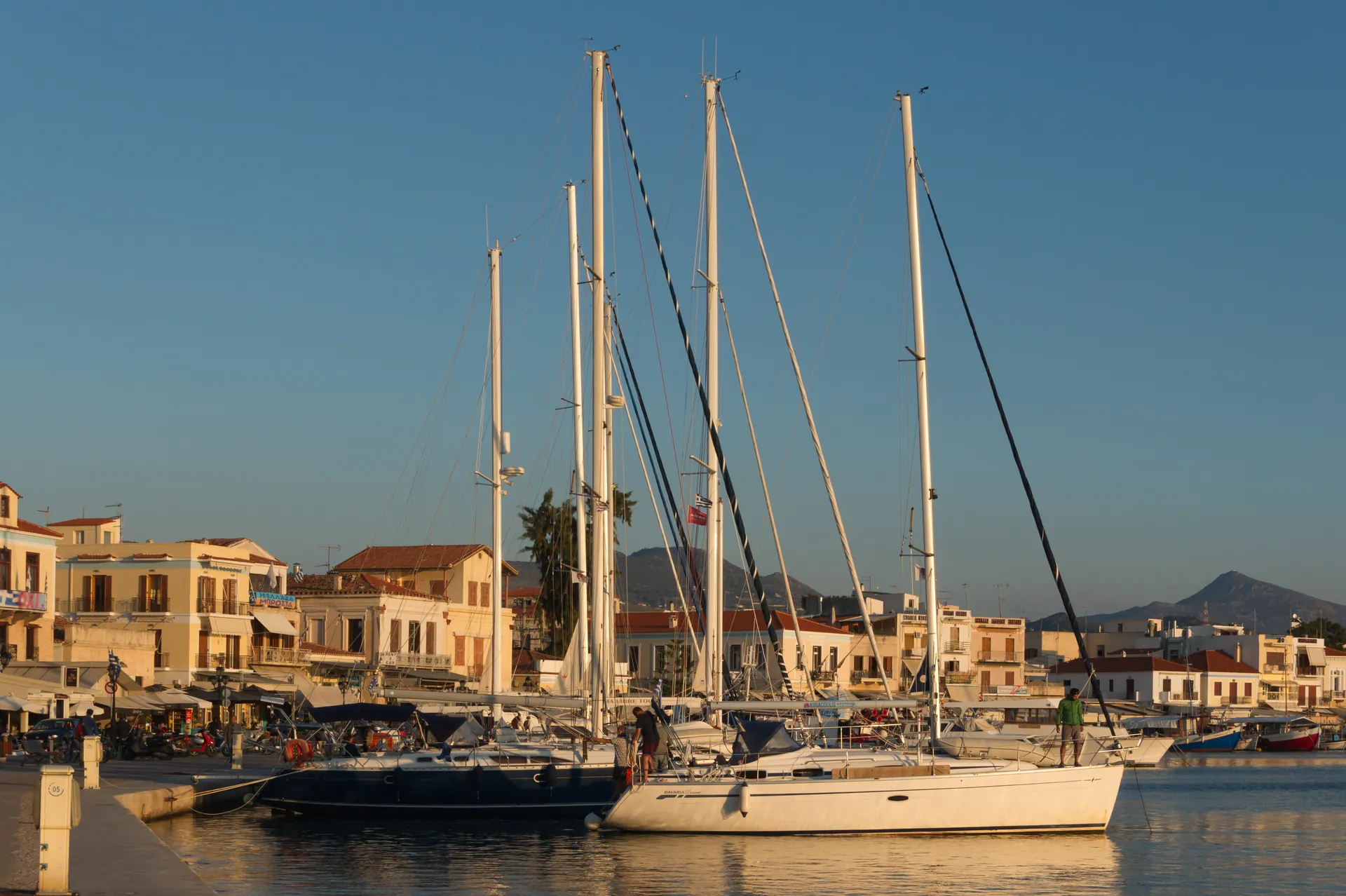Sailing boats moored in Aegina harbour, Greece, in evening light