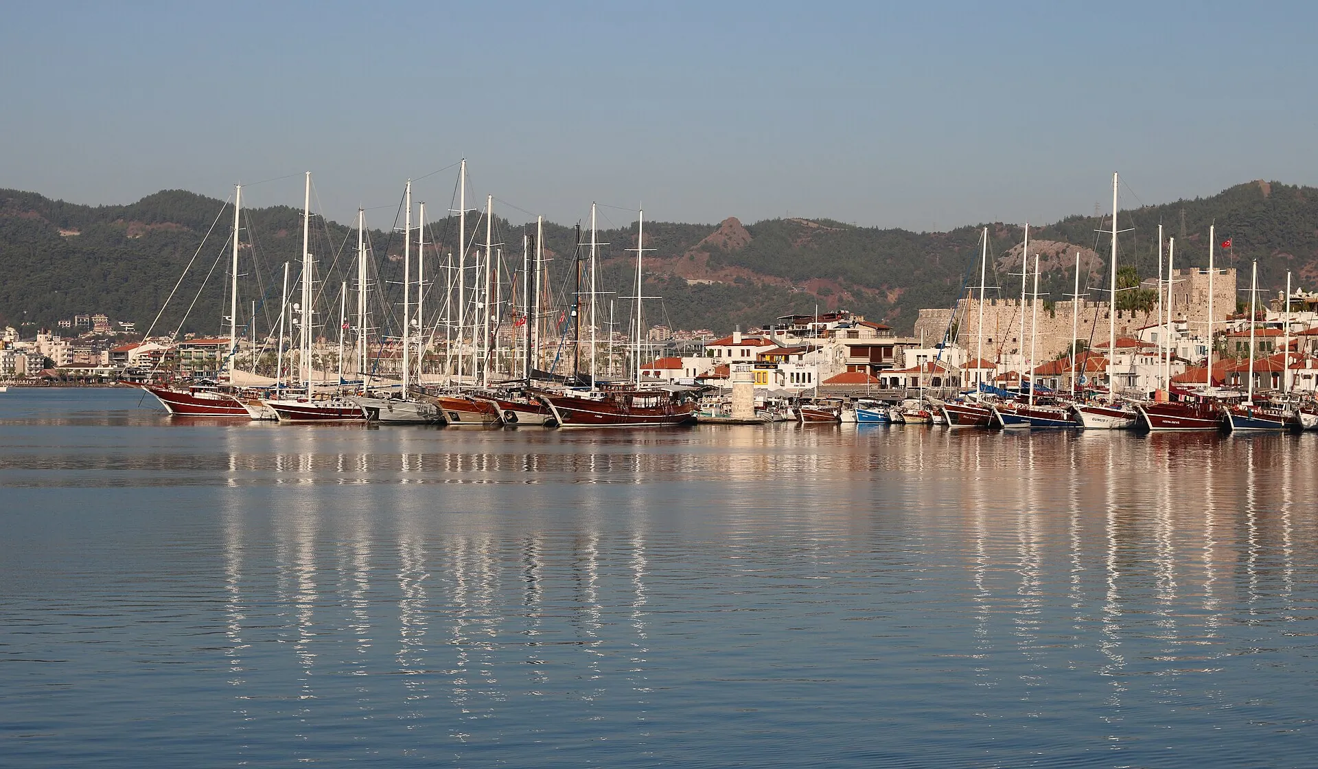 Charter sailboats and gulets moored along Marmaris marina, Turkey